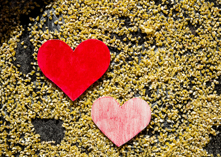 Valentines day background with hearts made by hands as giftの写真素材