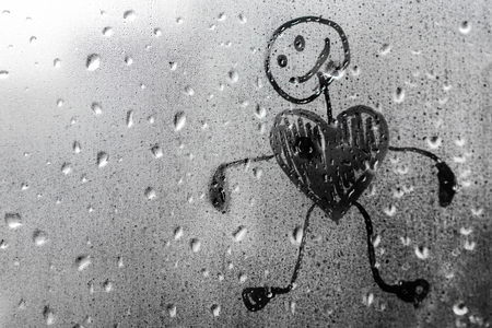 Human figure with a heart on a misted window Valentines dayの写真素材