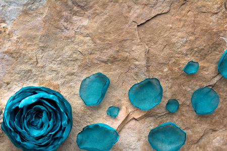 Handmade cepets laid out on a stone texture as a background for the inscriptions and the concept of springの写真素材