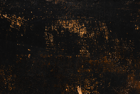 The metal texture of the background painted in black paint with smudges, scratches and splashes of brown rusty sparklesの写真素材