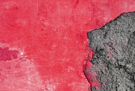 gray and red abstract rough textured plaster on the wall, old plastered wall, breakaway piece of plasterの写真素材