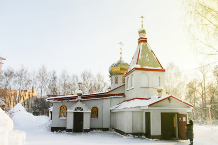 The church of St. Panteleimon, a man stands at the door to the church and praysの写真素材