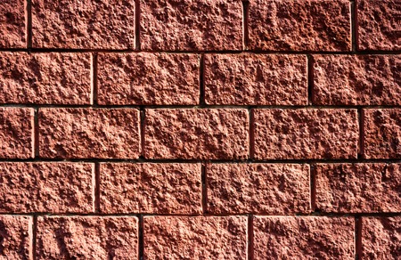 Decorative facing stone coral colour on the wall Background. Living Coral Color of the year 2019....