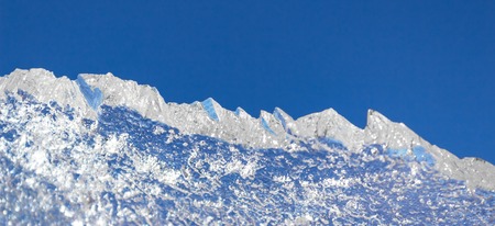 ice structure plate on a blue background from the refrigeration equipment, cool in the summer heat, air conditioningの写真素材