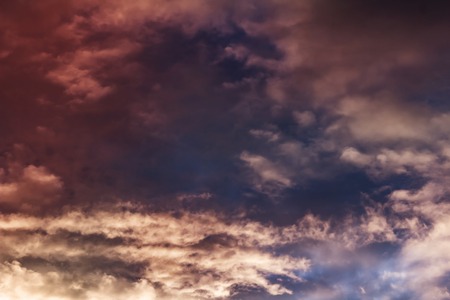 Colorful clouds on the sky. Color toned image in pinkの写真素材