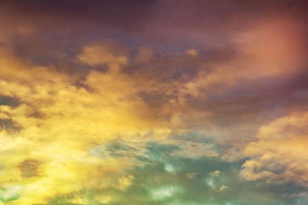 Clouds and fog with a colorful yellow to purple blue gradient. pleasing paper texture visible at 100