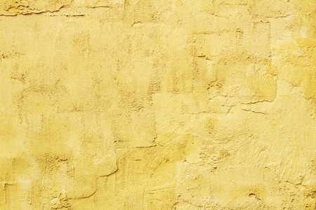 light yellow abstract textured plaster on the wallの写真素材