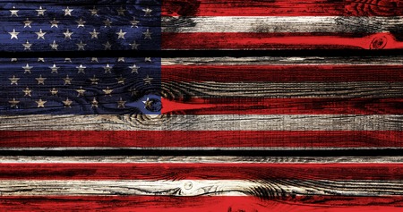 Flag of USA on Independence Day on the background and texture of a wooden bar with knots, concept of American Independence Day celebrationの写真素材