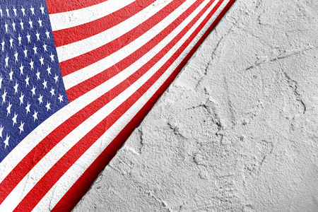 USA flag in the corner with a triangle on the background of rough gray plaster, copy space, top view, Happy Independence Day, postcard and wrapping paperの写真素材