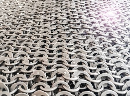 chainmail background, background of metal riveted rings, armor for defense in battle in antiquity