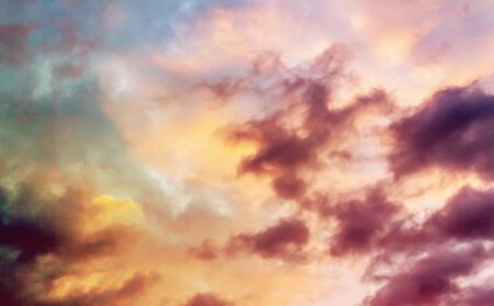 Colorful cumulus clouds on the sky. Color toned image in pinkの写真素材