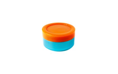 Cosmetics jar for cream 2020 trend colored in the Aqua Menthe and Lush Lava, isolated on whiteの写真素材