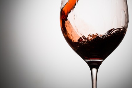 In glass closeup of pouring wine one-thirdの写真素材
