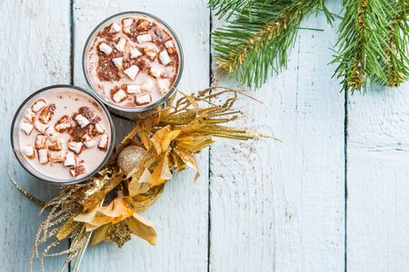 Two glasses cocoa with marshmallow on white wooden background. View from aboveの写真素材