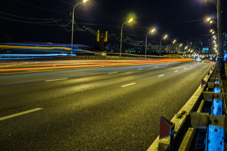 Blurred tail lights and traffic lights on road, Moscowの写真素材