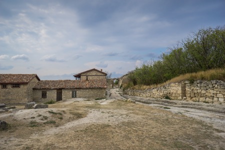 Old stone houses of the medieval town Chufut-Kale in the mountains. Bakhchisarai, Crimea.の写真素材