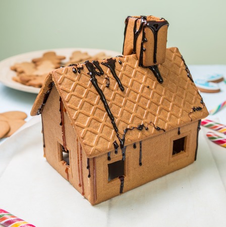 Homemade gingerbread house whit caramel on white backgroundの写真素材