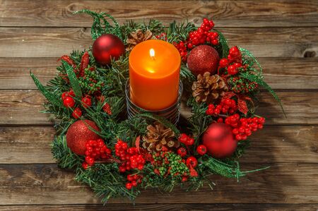 Advent wreath with candle on wooden table. Christmas time.の写真素材