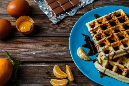 Wooden table with Viennese wafflesの写真素材
