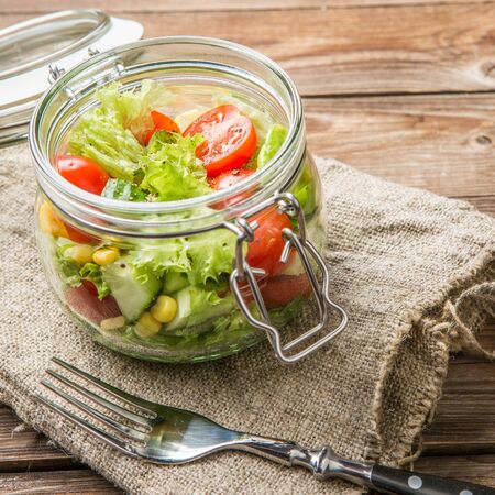 Fresh salad with cleaning clothの写真素材