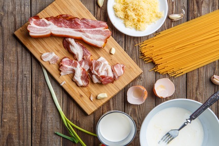 Cooking pasta carbonara on tableの写真素材