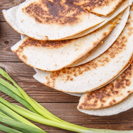 Tortillas with meat , green onions