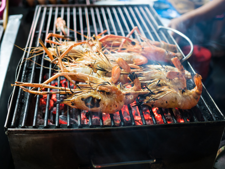 Seafood on grill in shopの写真素材