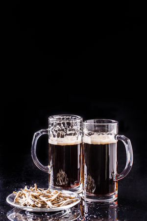 Mugs with beer and anchoviesの写真素材