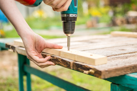 Man working with an electric screwdriverの写真素材