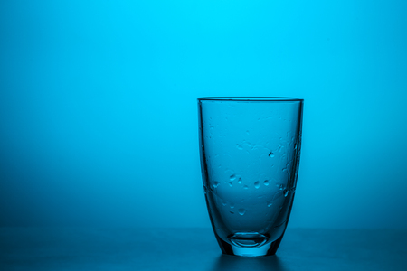 Transparent glass with water dropsの写真素材