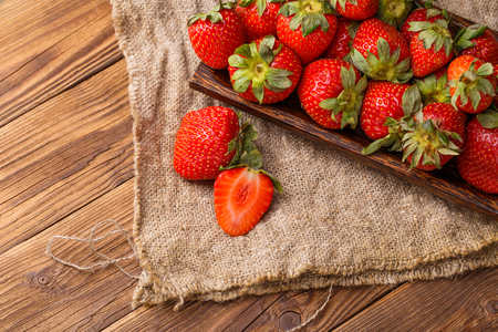 Strawberry on plate at tableの写真素材
