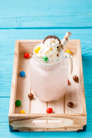 Fresh strawberry milkshakes on blue table.の写真素材