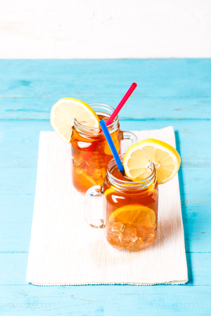 Iced tea in a glass jar with lemon.の写真素材