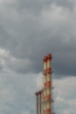 Industrial pipes on gray skyの写真素材