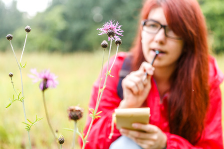 Field flower against of brunette