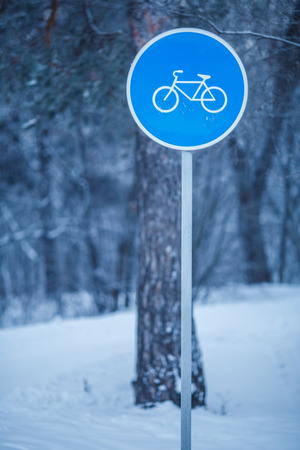 Winter trees with road signの写真素材