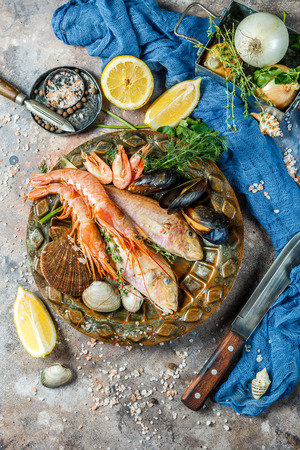 Sea fish, shrimp at tableの写真素材
