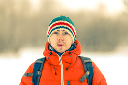 Portrait of man showing tongueの写真素材