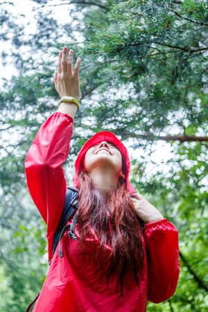 Photo of smiling woman in hoodの写真素材