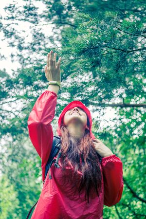 Photo of smiling woman in hoodの写真素材