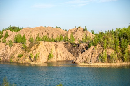 Picture of mountainous area with green trees and riverの写真素材