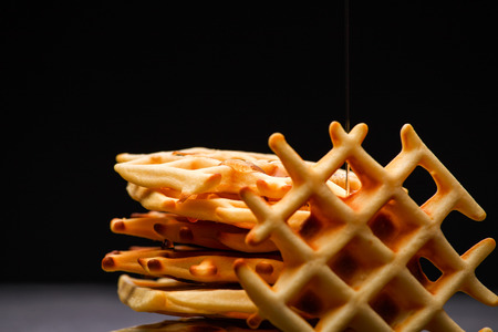 Photo of Viennese wafers on black background