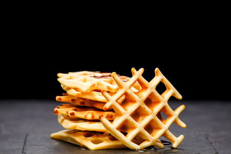 Photo of Viennese wafers on an blank black backgroundの写真素材