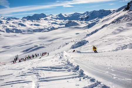 Image from afar skiers in snowy resort