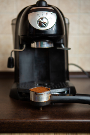 Coffee maker, spoon on tableの写真素材