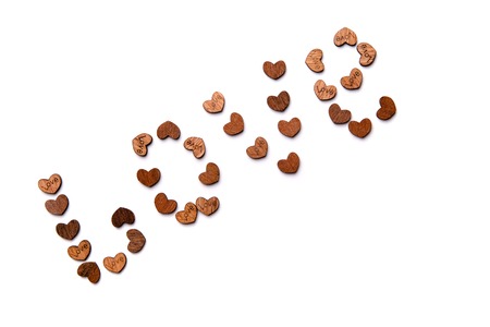 The word love is laid out from a variety of wooden heartsの写真素材
