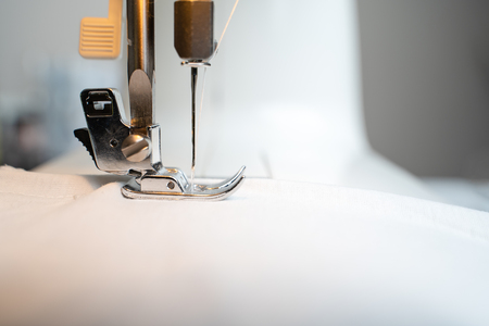 Closeup the sewing machine and item of clothing
