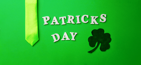 Lettering Patricks day, laid out on green background.の写真素材