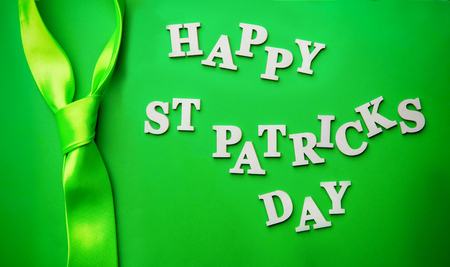 Lettering Happy St. Patricks day, laid out on green background.の写真素材