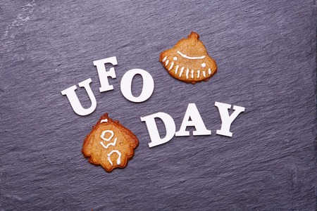 Text UFO day and cookies in the form of a flying saucer and an alienの写真素材